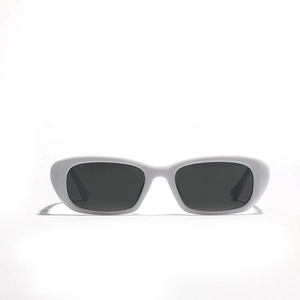 Retro oval white frame sunglasses with dark grey lenses in 90s vintage style