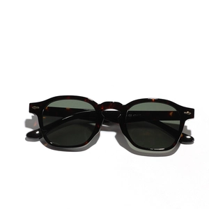 Retro tortoiseshell sunglasses with dark green lenses and silver arrow rivets