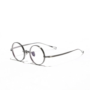 Minimalist silver titanium round glasses frames with hollow triangle temple details