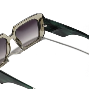 Y2K oversized square sunglasses with translucent frames and marbled temples in studio light