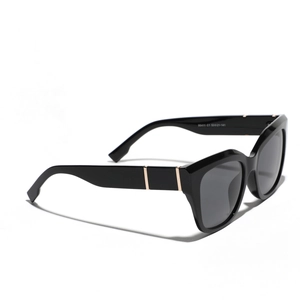 Lunettes de soleil œil de chat chic noires pour femmes avec branches dorées et verres gris