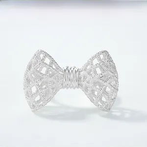 Detailed macro view of S925 sterling silver bow ring with intricate lace texture