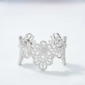 Close-up of S925 silver lace flower ring with zircon stones and adjustable open band
