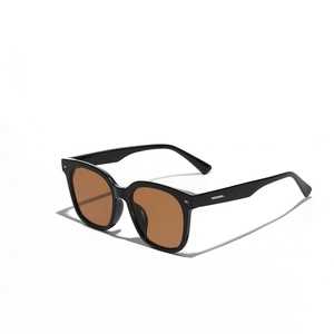 Black square oversized sunglasses with silver metal rivets and dark brown lenses