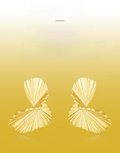 Close-up of gold-plated silver earrings with hand-brushed texture and fan design