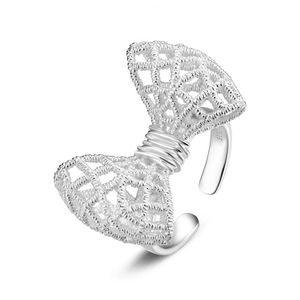 S925 sterling silver bow ring with intricate lace texture in a minimalist open design