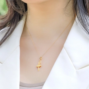 Elegant 925 sterling silver ballet dancer pendant necklace in gold finish on female model