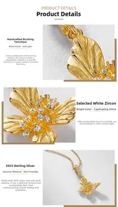 Macro shot of S925 sterling silver butterfly pendant with brushed gold finish and zircons