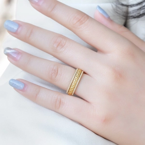 Quilted gold rings set with sparkling diamond bands in a stacked elegant jewelry style