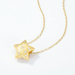 Golden star pendant necklace with brushed texture and zircon stones on O-chain