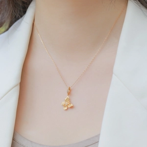 Elegant gold-plated S925 sterling silver butterfly necklace with zircon on a model