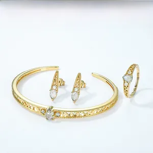 Detail of S925 silver gold-plated jewelry set with lab-grown moonstones and filigree art