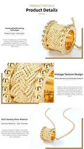 Macro view of gold S925 sterling silver barrel pendant with woven texture and beads