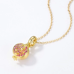 Golden brushed pomegranate pendant necklace with pink cubic zirconia stones
