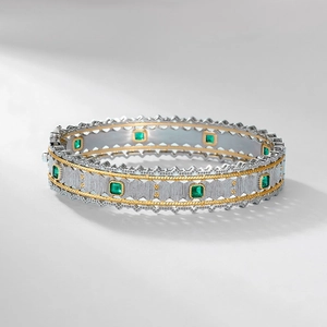 Luxurious S925 sterling silver open bangle featuring brushed texture and emerald gemstones