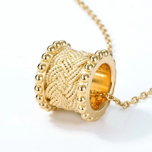 Golden S925 sterling silver cylinder necklace with woven texture on a white background