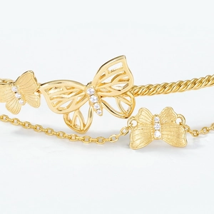 Handcrafted S925 silver double-layer butterfly bracelet with gold brushed finish and zircon