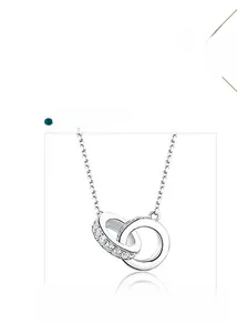 Detail of interlocking double-ring pendant necklace with cubic zirconia in white gold plating