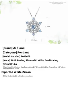 Detail of S925 sterling silver snowflake pendant with blue spinel and white zircon