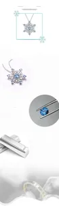 Macro shot of 925 sterling silver snowflake pendant with blue spinels and white zircons