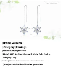 Detail of S925 sterling silver snowflake earrings with blue spinel and white zircon