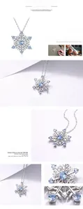 Macro shot of 925 silver snowflake pendant with light blue crystal and fine zircons