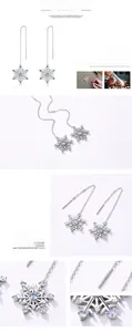 Macro detail of S925 sterling silver snowflake tassel earrings with blue cubic zirconia