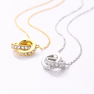 Minimalist double interlocking circle necklaces in gold and silver with zircon accents