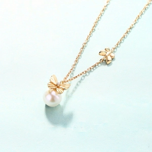 Elegant S925 silver necklace with golden bow pendant and round white freshwater pearl
