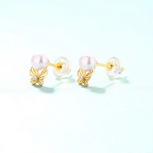 Elegant 925 silver gold bow earrings with freshwater pearls and zircon accents