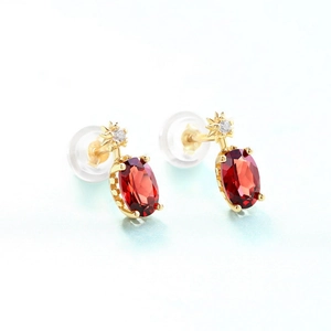 Elegant S925 silver oval garnet stud earrings with star accent and gold finish