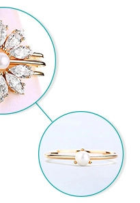Detail of S925 silver ring with natural pearl and marquise-cut zircon in gold finish