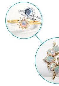Detailed view of teardrop Swiss blue topaz and opal sunflower rings in gold plating