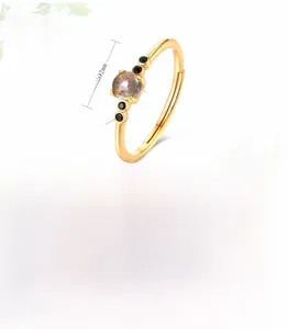 Macro detail of S925 silver ring with 9K gold plating and natural Labradorite stone