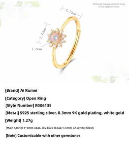 Detail of sunflower ring in 925 silver 9K gold with opal center and zircon petals