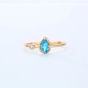 Teardrop blue topaz ring in S925 silver with gold plating and white zircon accents