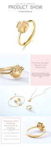 Close-up of S925 silver cat paw ring with sparkling white zircon and gold plating