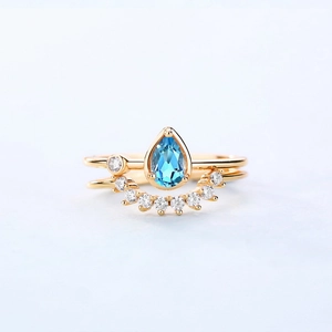 Teardrop Swiss blue topaz gold plated silver ring set with white zircon accents