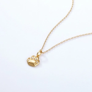 Golden cat paw pendant necklace with sparkling cubic zirconia on minimalist fine chain