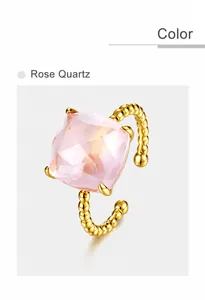 Detailed view of square rose-cut pink quartz on a golden beaded adjustable silver ring