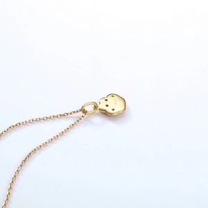 Gold plated S925 silver cat paw pendant necklace showing the S925 hallmark on the back
