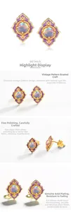 Detail of vintage silver earrings with purple enamel, gold plating and natural opal stone