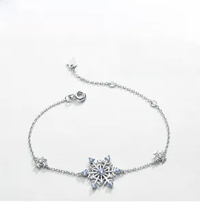 Detailed view of silver snowflake bracelet with blue spinels and white zircons