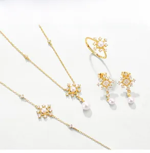 Macro detail of vintage 925 silver jewelry set with pearls and snowflake patterns
