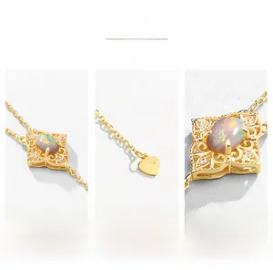 Macro shot of S925 silver 9K gold opal necklace with intricate floral lace carving