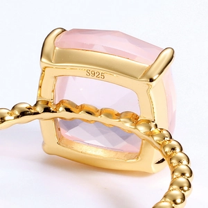 Close-up of S925 sterling silver ring with large square pink quartz and beaded band texture