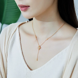 Elegant gold S925 silver necklace with opal pendant and lace petal design on model