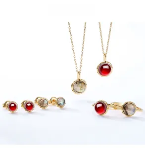 Detailed set of S925 sterling silver gold-plated jewelry with red and gray gemstones