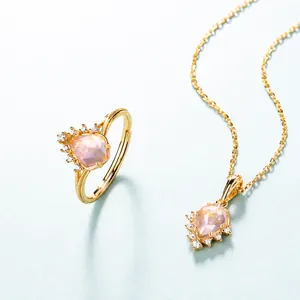 Detail of pear-cut pink crystal ring and necklace set with gold plating and zircons