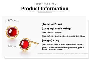 Macro shot of S925 sterling silver ear studs with 5mm natural red garnet stones